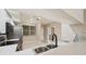 Modern kitchen with stainless steel sink, appliances, and bar seating at 1200 Country Club Dr # 6103, Largo, FL 33771