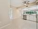 Modern kitchen featuring white cabinets, stainless steel appliances, and tiled floors at 1200 Country Club Dr # 6103, Largo, FL 33771