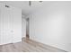 An open bedroom with multiple doors and neutral walls, ready for customization at 400 150Th Ave # 302, Madeira Beach, FL 33708