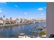 Scenic water view displaying waterfront homes along a canal, enhanced by numerous boats at 400 150Th Ave # 302, Madeira Beach, FL 33708