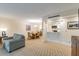 Spacious living room with comfortable seating and access to a private balcony at 36750 Us Highway 19 N # 21305, Palm Harbor, FL 34684