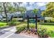 Rosemount Lodge condo building with landscaping at 36750 Us Highway 19 N # 21305, Palm Harbor, FL 34684