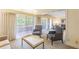 Open living area with two armchairs and a view into another living space at 36750 Us Highway 19 N # 21305, Palm Harbor, FL 34684