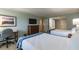 Bedroom with two double beds, dresser, and workspace at 36750 Us Highway 19 N # 21305, Palm Harbor, FL 34684