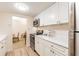 Modern kitchen with white cabinets, stainless steel appliances, and quartz countertops at 36750 Us Highway 19 N # 21305, Palm Harbor, FL 34684
