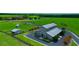 Large barn with paved driveway, surrounded by greenery at 33642 Blanton Rd, Dade City, FL 33523