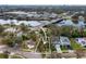 Aerial view of a property near a bridge and body of water with mature trees surrounding the neighborhood at 2608 N Ridgewood Ave, Tampa, FL 33602