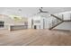 Expansive open-concept living area with modern staircase and gourmet kitchen at 2608 N Ridgewood Ave, Tampa, FL 33602