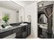 Bright bathroom with double sinks, a large mirror, and a shower at 5940 Pelican Bay S Plz # 1204, Gulfport, FL 33707