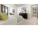 Spacious bedroom with light wood floors, ceiling fan, and dresser at 5940 Pelican Bay S Plz # 1204, Gulfport, FL 33707