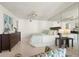 Main bedroom features light floors, a ceiling fan, and mirrored wall at 5940 Pelican Bay S Plz # 1204, Gulfport, FL 33707