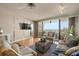 Living room offers hardwood floors and water views at 5940 Pelican Bay S Plz # 1204, Gulfport, FL 33707