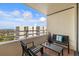 Balcony with seating and glass-top table, water views at 5940 Pelican Bay S Plz # 1204, Gulfport, FL 33707