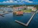 Aerial view of waterfront property with building, dock, and marina at 622 Edgewater Dr # 822, Dunedin, FL 34698