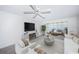 Living room with water view, comfortable sofas, and a coffee table at 622 Edgewater Dr # 822, Dunedin, FL 34698