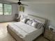 Main bedroom with king-size bed, nightstands, and large windows at 3315 58Th S Ave # 218, St Petersburg, FL 33712