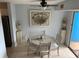 Bright dining area with a round table and four chairs, featuring unique artwork at 3315 58Th S Ave # 218, St Petersburg, FL 33712