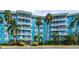Blue building exterior, palm trees, and parking lot at 3315 58Th S Ave # 218, St Petersburg, FL 33712