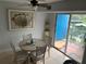 Bright dining area with table and chairs, and access to balcony at 3315 58Th S Ave # 218, St Petersburg, FL 33712