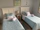 Guest bedroom with two twin beds and updated decor at 3315 58Th S Ave # 218, St Petersburg, FL 33712