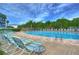 Relaxing community pool with plenty of lounge chairs at 3315 58Th S Ave # 218, St Petersburg, FL 33712