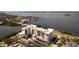 Stunning aerial view of waterfront condos showcasing sleek design and picturesque bay views at 1020 Sunset Point Rd # 603, Clearwater, FL 33755