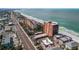 Breathtaking aerial view of the condo complex and beach with pristine blue waters and a bright blue sky at 15316 Gulf Blvd # 604, Madeira Beach, FL 33708
