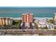 Beautiful aerial shot of a beachfront condo building with scenic ocean views and well-kept grounds at 15316 Gulf Blvd # 604, Madeira Beach, FL 33708