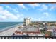 Balcony with a view of the beach and cityscape, offering a beautiful and serene view at 15316 Gulf Blvd # 604, Madeira Beach, FL 33708