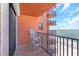 Balcony featuring a white chair and ocean view, providing a calm and relaxing outdoor experience at 15316 Gulf Blvd # 604, Madeira Beach, FL 33708