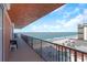 Relaxing oceanfront balcony with seating, offering stunning views of the beach and clear blue waters at 15316 Gulf Blvd # 604, Madeira Beach, FL 33708