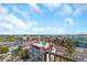 City view from balcony, showcasing beautiful rooftops and blue skies, perfect for relaxation at 15316 Gulf Blvd # 604, Madeira Beach, FL 33708