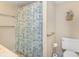 Cozy full bath featuring stylish fish-themed shower curtain and neutral fixtures at 15316 Gulf Blvd # 604, Madeira Beach, FL 33708