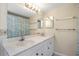Bathroom boasts dual sinks, ample lighting, and a large mirror at 15316 Gulf Blvd # 604, Madeira Beach, FL 33708
