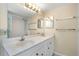 Bright bathroom featuring double sinks, large mirror, and great lighting at 15316 Gulf Blvd # 604, Madeira Beach, FL 33708