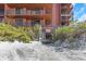 Direct beach access from the condo building with a wooden walkway through lush greenery at 15316 Gulf Blvd # 604, Madeira Beach, FL 33708