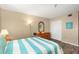 Comfortable bedroom with closet, wood-look floors, and tasteful decor at 15316 Gulf Blvd # 604, Madeira Beach, FL 33708
