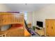 Cozy bedroom featuring a wood bunk bed, TV, and stylish decor for comfortable living at 15316 Gulf Blvd # 604, Madeira Beach, FL 33708