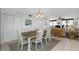 Open concept dining area with seating for six and easy access to the living area at 15316 Gulf Blvd # 604, Madeira Beach, FL 33708