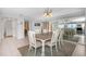 Spacious dining area with a table for six, ideal for entertaining guests at 15316 Gulf Blvd # 604, Madeira Beach, FL 33708