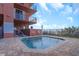 Relaxing hot tub with brick-paved area and safety railing offering a serene outdoor experience at 15316 Gulf Blvd # 604, Madeira Beach, FL 33708