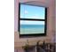 A well-lit kitchen sink and counter space offer a view of the ocean, blending functionality with scenic beauty at 15316 Gulf Blvd # 604, Madeira Beach, FL 33708