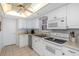Bright kitchen featuring white cabinetry, modern appliances, and a clean, functional design for cooking at 15316 Gulf Blvd # 604, Madeira Beach, FL 33708