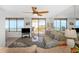 Inviting living room with ocean view, balcony access, and stylish decor at 15316 Gulf Blvd # 604, Madeira Beach, FL 33708