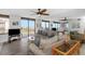 Bright living room with sliding doors to balcony and stylish furnishings at 15316 Gulf Blvd # 604, Madeira Beach, FL 33708