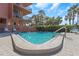 Inviting community pool surrounded by lush landscaping, providing a tranquil and refreshing retreat at 15316 Gulf Blvd # 604, Madeira Beach, FL 33708