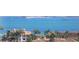Aerial view showcasing waterfront property and lush landscaping at 5200 Brittany S Dr # 4-1102, St Petersburg, FL 33715