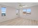 Spacious bedroom with water views and ceiling fan at 5200 Brittany S Dr # 4-1102, St Petersburg, FL 33715