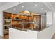 Modern kitchen with granite countertops and stainless steel appliances at 5200 Brittany S Dr # 4-1102, St Petersburg, FL 33715