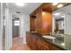 Elegant bathroom with double vanity, granite countertop, and walk-in shower at 5200 Brittany S Dr # 4-1102, St Petersburg, FL 33715